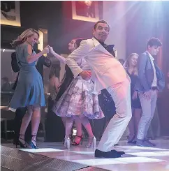  ?? — UNIVERSAL PICTURES ?? Rowan Atkinson does provide some of its few laughs in an all-too-brief dance sequence.