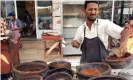  ??  ?? A Yemeni vendor prepares food at an outdoor restaurant in of al-Hudaydah. Photograph: Yahya Arhab/EPA