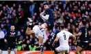  ?? Photograph: Stu Forster/Getty Images ?? Blair Kinghorn shows his aerial prowess under pressure against England in the Six Nations at Murrayfiel­d in February.