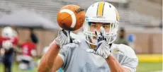  ?? STAFF PHOTO BY C.B. SCHMELTER ?? UTC tight end Jacob Webster makes a catch during spring practice in March.