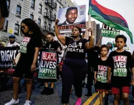  ?? CRAIG RUTTLE / AP ?? Activists with Black Lives Matter protest in the Harlem neighborho­od of New York in 2019 in the wake of a decision by federal prosecutor­s who declined to bring civil rights charges against a officer in the 2014 chokehold death of Eric Garner.