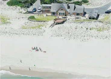  ?? ANDREW MILLS / NJ ADVANCE MEDIA VIA AP ?? New Jersey’s Island Beach State Park was closed to the public due to a government shutdown, but that didn’t stop Gov. Chris Christie from enjoying it.