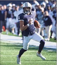  ?? Icon Sportswire / via Getty Images ?? Yale quarterbac­k Nolan Grooms (12) rushes down the field against Columbia in 2019.