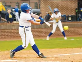  ?? STAFF PHOTO BY ROBIN RUDD ?? Boyd’s Gracie Petty (14) hits an RBI single Monday. The Whitwell Lady Tigers visited the Boyd Buchanan Lady Bucs in TSSAA softball action.