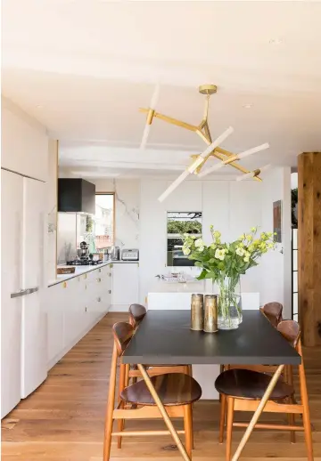  ??  ?? KITCHEN The couple worked with Kitchen Mania to renovate their kitchen and create a light, bright space that blends easily into the living room. The island was extended to create a second seating area for casual dining and cups of tea.