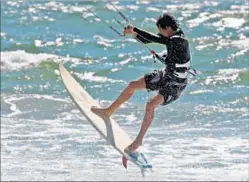  ?? Mark Boster Los Angeles Times ?? gets some offshore air time while kite surfing. A VISITOR