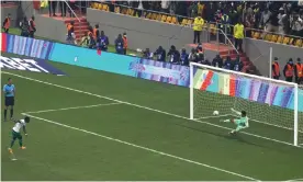  ?? Photograph: Stefan Kleinowitz/AP ?? Senegal's Sadio Mane (left) hits his penalty down the middle to send his country to the World Cup at Egypt’s expense.