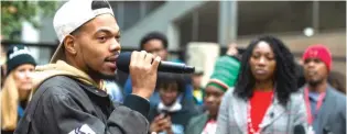  ?? TYLER LARIVIERE/SUN-TIMES ?? Chance the Rapper at a rally for Amara Enyia (right) on Oct. 27.