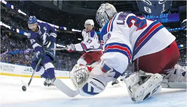  ?? BRUCE BENNETT/Getty Images ?? Steven Stamkos of the Tampa Bay Lightning scores a goal in the first period against Henrik Lundqvist of the New York Rangers during Game Three of the Eastern Conference Finals during the 2015 NHL Stanley Cup Playoffs at Amalie Arena
on Wednesday night...