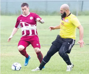  ??  ?? Liam McCafferty beats his opponent to the ball when Bunyip hosted ETA Buffalo to get their FFA Cup campaign underway.