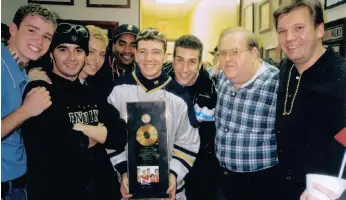  ?? | Courtesy of A Youtube Originals presents, a Pilgrim Media Group and ?? ‘N SYNC with manager Lou Pearlman, second from right, in happier times. Lance Bass Production­s film