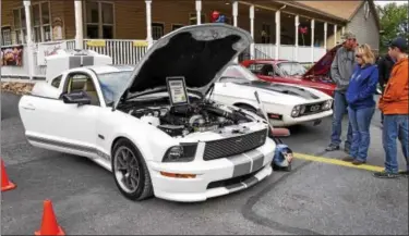  ?? SUBMITTED PHOTO - CARL HESS ?? A group of people, all from the Northeast Berks area, stop to admire Michael Ray’s 2007 Shelby GT/SC which is #34 of only 50 that were produced.