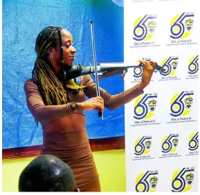  ?? ?? Ms. Rosmery Martin, Violinist shares a musical tribute at the President’s Knight’s Day at UTech, Jamaica’s Western Campus on October 13, 2023.