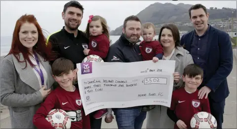  ??  ?? Niamh Doyle from LauraLynn accept the cheque from Ruairí, Dan and Sarah Kiely, Fearghus, Anna and Fiona McHugh, Vice Chair Ardmore Declan Cobbe and Finn Kiely from Ardmore Rovers.