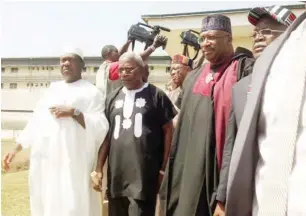  ??  ?? From left, Senators Akume, Waku, minister of Interior, Abdulraham Dambauzau and Governor Ortom coming out of the BSUTH morgue