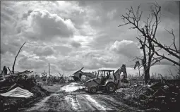  ?? RAMON ESPINOSA/AP ?? A bulldozer clears a road after Hurricane Dorian on Grand Bahama island, Bahamas.