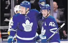  ?? FRANK GUNN THE CANADIAN PRESS ?? Toronto Maple Leafs left wing James van Riemsdyk, left, celebrates a goal with teammate Tyler Bozak.