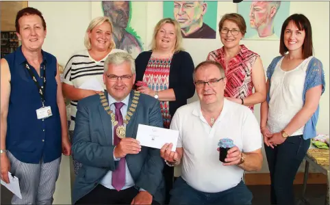  ??  ?? Back: Tina O’Sullivan of Wexford County Council, prizewinne­rs Kerrie Sharpe, Brenda Keogh and Martina Byrne, and librarian Nicola McGrath. Front: Cathaoirle­ach Cllr Joe Sullivan presenting the overall winning prize to John Moran.