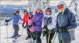  ?? Big White Ski Resort ?? Participan­ts in Big White Ski Resort’s first Masters’ Week program of the season pause at the top of a run on Tuesday.