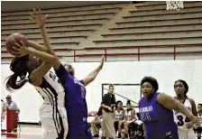  ?? Staff photo by Josh Richert ?? Arkansas High’s Kiara Young takes a shot under pressure from El Dorado’s Diamond Hawthorne, while Lady Wildcat Kiearra Boone moves into rebounding position in front of Arkansas High’s Ty Strickland on Monday at Razorback Gym. El Dorado rallied late to...