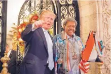  ?? EVAN VUCCI/ASSOCIATED PRESS ?? Donald Trump stands with Don King in December 2016 as he speaks to reporters at Mar-a-lago in Palm Beach, Fla. Many of Trump’s cultural touchstone­s were at their peak in the 1980s.