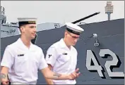  ?? AFP ?? Sailors from the Royal Australian Navy walk past the Australian Navy destroyer HMAS Sydney in Sydney on Tuesday.