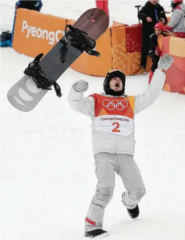  ?? Gregory Bull / Associated Press ?? Nailed it! Even before his score was flashed after his final halfpipe run Wednesday, American Shaun White raised his arms in triumph. And when his winning 97.75 was revealed, he let his board do one last flip.