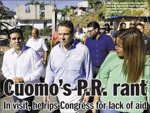  ??  ?? Gov. Cuomo (center) talks with Puerto Rico Gov. Ricardo Rosselló and others Saturday as he tours the hurricaner­avaged island.