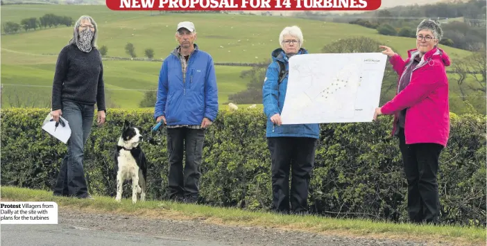  ??  ?? Protest Villagers from Dailly at the site with plans for the turbines