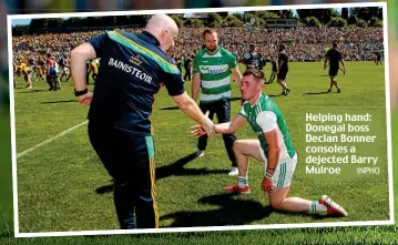  ?? INPHO ?? Helping hand: Donegal boss Declan Bonner consoles a dejected Barry Mulroe