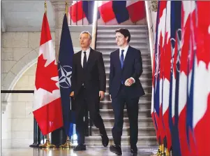  ?? CP PHOTO ?? Prime Minister Justin Trudeau and NATO Secretary General Jens Stoltenber­g arrive to take part in a joint press conference on Parliament Hill in Ottawa on Wednesday.