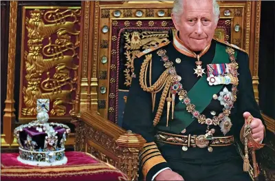  ?? ?? LOOKING GLUM: Prince Charles alongside the Imperial State Crown at last week’s State Opening of Parliament