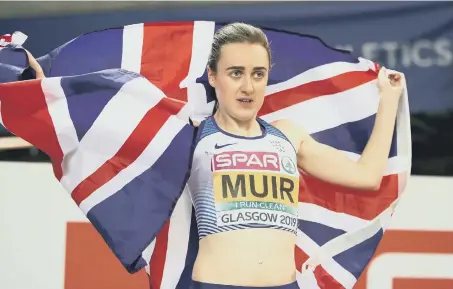  ??  ?? Laura Muir celebrates winning the gold medal at the Women’s 1500m Final at the European Indoor Athletics Championsh­ips last night.