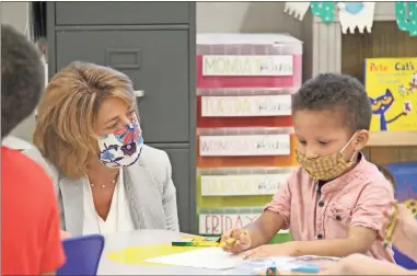  ?? Contribute­d, File ?? Gordon County Schools Superinten­dent Kimberly Fraker visits with a student during the first day of class in August 2020.