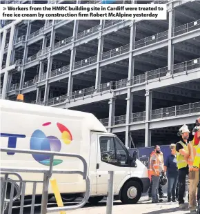  ??  ?? &gt; Workers from the HMRC building site in Cardiff were treated to free ice cream by constructi­on firm Robert McAlpine yesterday