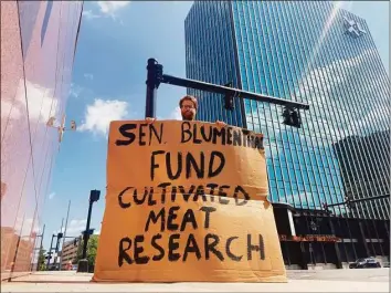  ?? Jon Hochschart­ner / Contribute­d photo ?? Jon Hochschart­ner protests outside Sen. Richard Blumenthal’s office in Hartford.