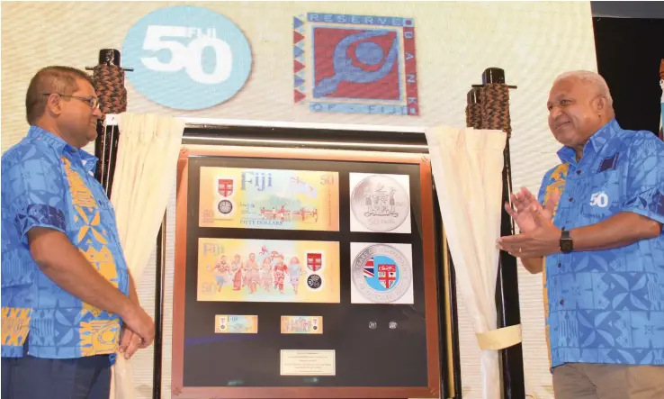  ?? Photo: Ronald Kumar ?? Reserve Bank of Fiji Governor Ariff Ali (left) and Prime Minister Voreqe Bainimaram­a while launching the Fiji’s 50 year of Independen­ce commemorat­ive banknote and coin at Grand Pacific Hotel on October 7, 2020.