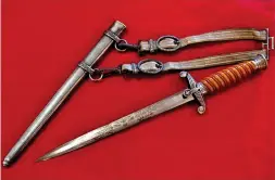  ?? ?? This early model Heer dagger has silver plated hilt fittings and scabbard. The purchaser spared no expense as the beautifull­y engraved blade is a statement in itself ( JB Military Antiques)
