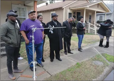  ?? (Arkansas Democrat-Gazette/John Sykes Jr.) ?? Lakeshia Smith and Jacquelyn Tate (right), mother of Brittany Dunyae Tate, embrace at a Tuesday news conference on South Ringo Street, near where Brittany was killed. Members of Arkansas Stop the Violence, including Benny Johnson (second from left), and the Central Arkansas Chapter of Parents of Murdered Children attended the news conference. More photos at arkansason­line. com/129victims/.