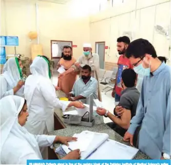  ??  ?? ISLAMABAD: Patients stand in line at the registry kiosk of the Pakistan Institute of Medical Science’s pollen allergy emergency centre in Islamabad, Pakistan.—Reuters