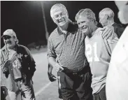  ?? TERRY, THE OKLAHOMAN] ?? Former Cashion coach Larry Mantle (center) talks with one of his former football players during a 2013 reunion. Mantle, the youngest brother of Hall of Fame baseball player Mickey Mantle, died Monday at age 79. [BRYAN