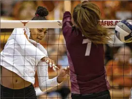 ?? NICK WAGNER / AMERICAN-STATESMAN ?? Texas State’s Amy Pflughaupt (right) was named the Sun Belt Conference’s offensive player of the week for the second time this season. She totaled 48 kills and 25 digs in three matches last week.