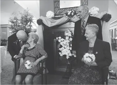  ?? TYLER BROWNBRIDG­E ?? John and Doris Kubris, left, and Bernard and Sheila Marontate renew their wedding vows on Valentine’s Day at the Chartwell retirement home Tuesday in Kingsville. John and Doris have been married for 70 years, while Bernard and Sheila have been husband...