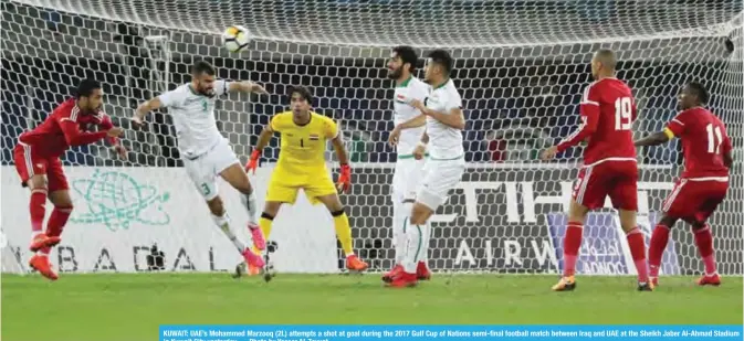  ?? — Photo by Yasser Al-Zayyat ?? KUWAIT: UAE’s Mohammed Marzooq (2L) attempts a shot at goal during the 2017 Gulf Cup of Nations semi-final football match between Iraq and UAE at the Sheikh Jaber Al-Ahmad Stadium in Kuwait City yesterday.