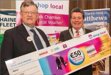  ??  ?? Paddy Malone and Paddy Matthews promoting Shop Local vouchers.