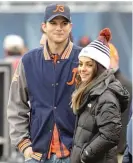  ??  ?? Ashton Kutcher and Mila Kunis at Soldier Field before a Bears game.
| SUN- TIMES FILES