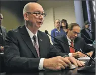  ?? Arkansas Democrat-Gazette/STATON BREIDENTHA­L ?? Rep. Bruce Cozart (left) talks about his bill, HB1539, on Tuesday along with Lucian Spataro during a meeting of the House Education Committee. The bill would make passing a civics test a requiremen­t for a high school diploma.