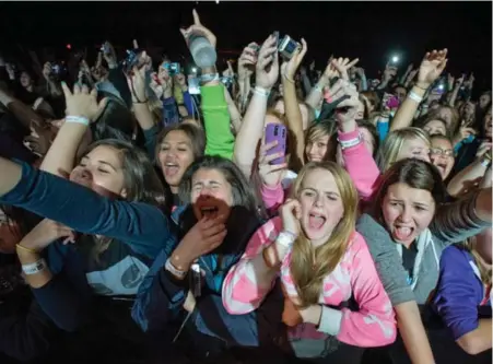  ?? RICK MADONIK/TORONTO STAR FILE PHOTO ?? Fans go crazy for Justin Bieber during a show in Toronto a few years ago. “Screaming is a way (for young girls) to control a situation,” one expert says.