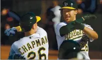  ?? RAY CHAVEZ — STAFF PHOTOGRAPH­ER ?? The Athletics’ Matt Chapman, left, and Matt Olson celebrate after Olson hit a grand slam off Minnesota Twins pitcher Jorge Alcala.