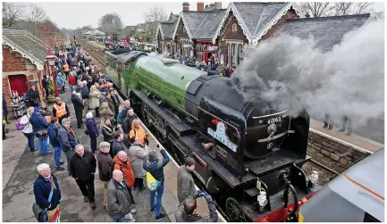  ??  ?? Just the ticket: Enthusiast­s flock round the locomotive at Appleby Station in Cumbria yesterday